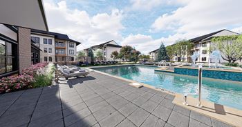 A swimming pool surrounded by apartment buildings.